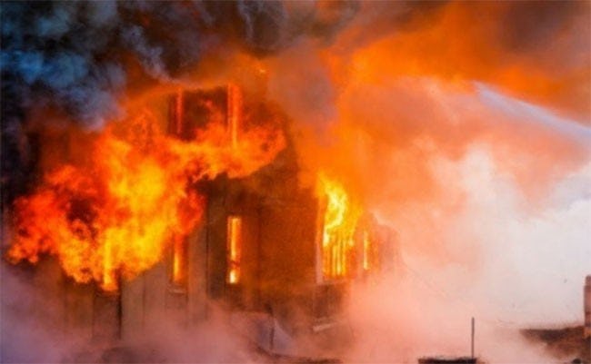  One dead, nine injured in fire set by unidentified group
