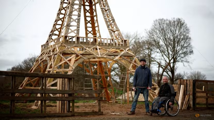 Two friends build Eiffel Tower from recycled wood ahead of Olympics